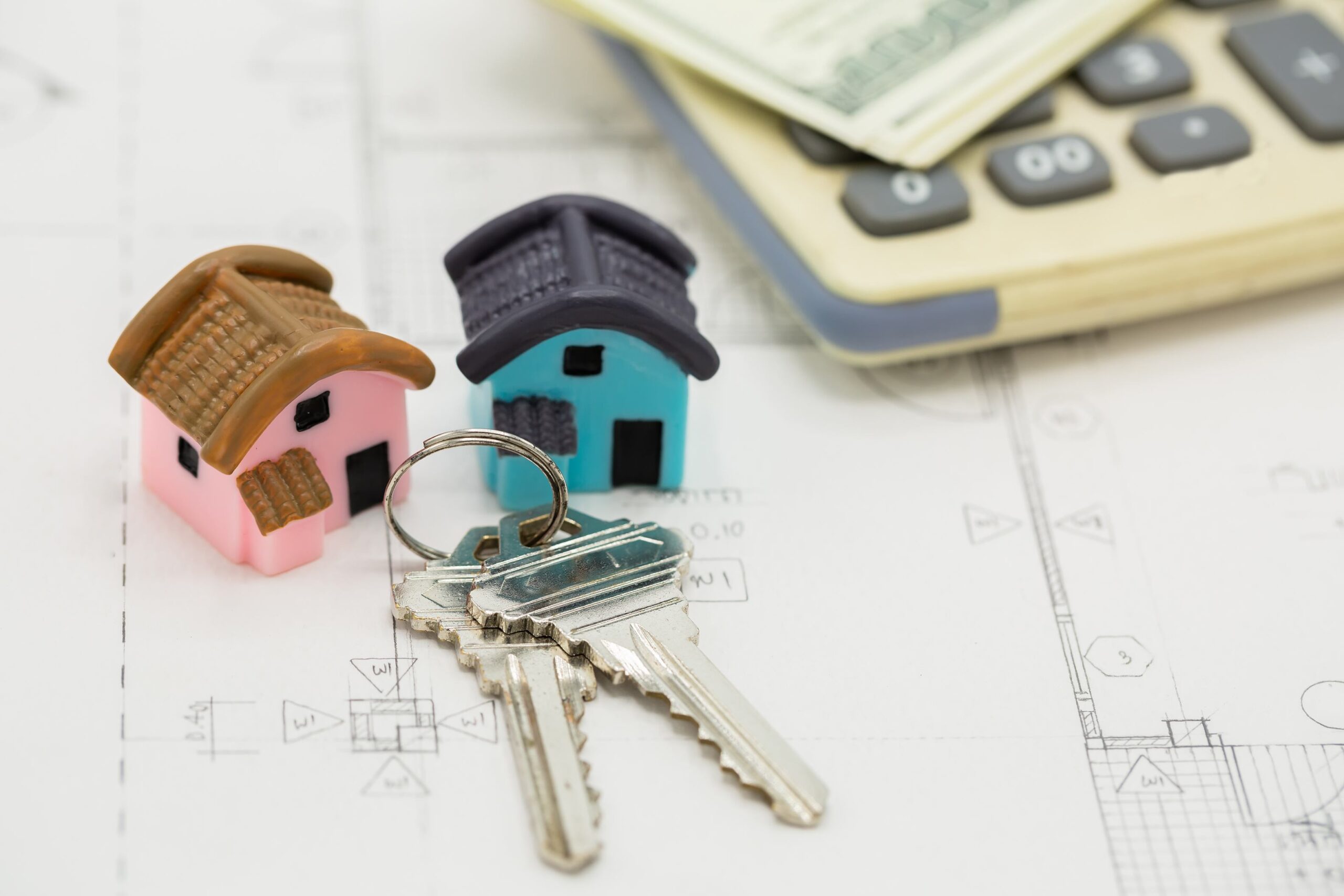 house-key-calculator-with-dollar-bills