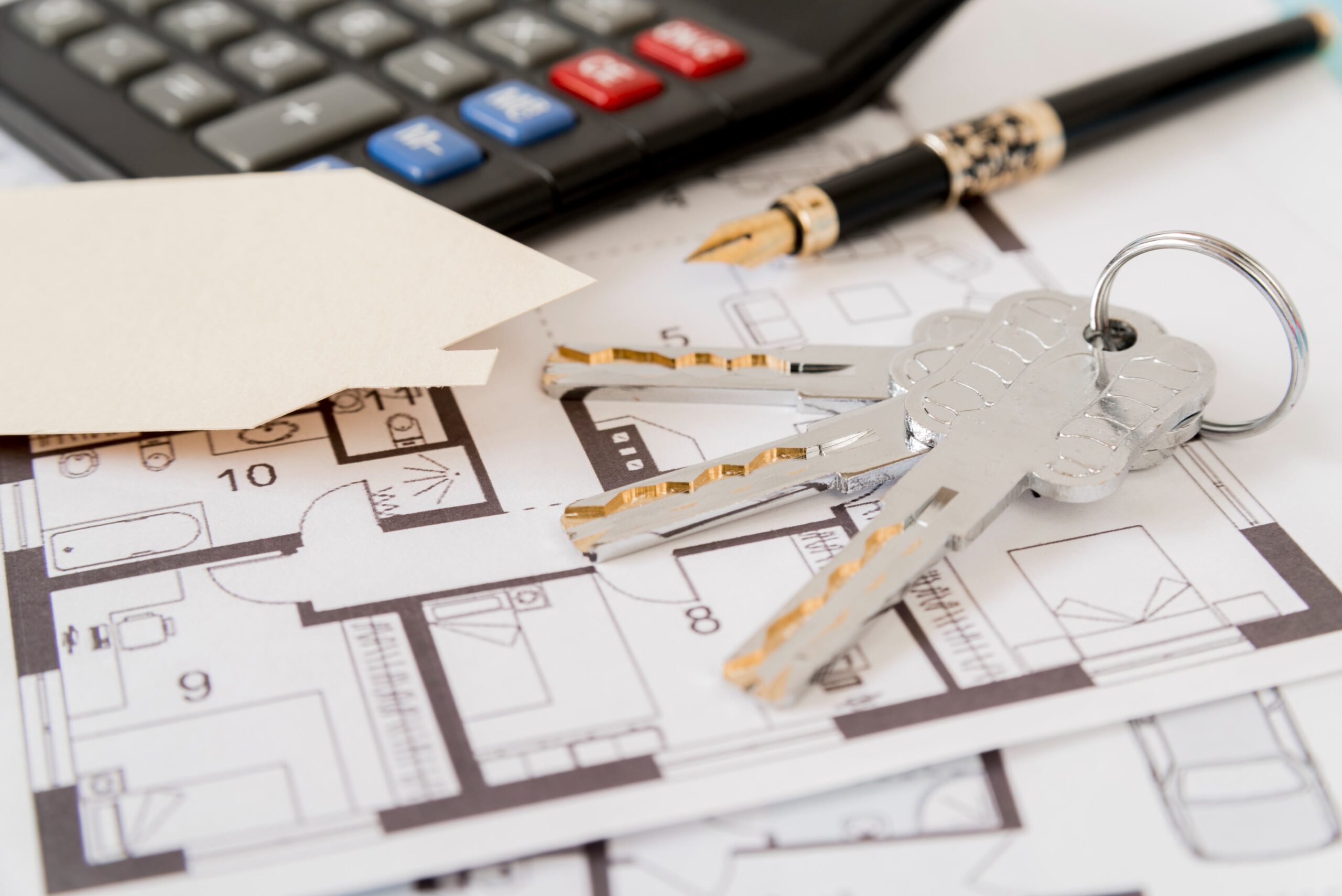 keys-fountain-pen-house-paper-cut-out-calculator-architectural-blueprints