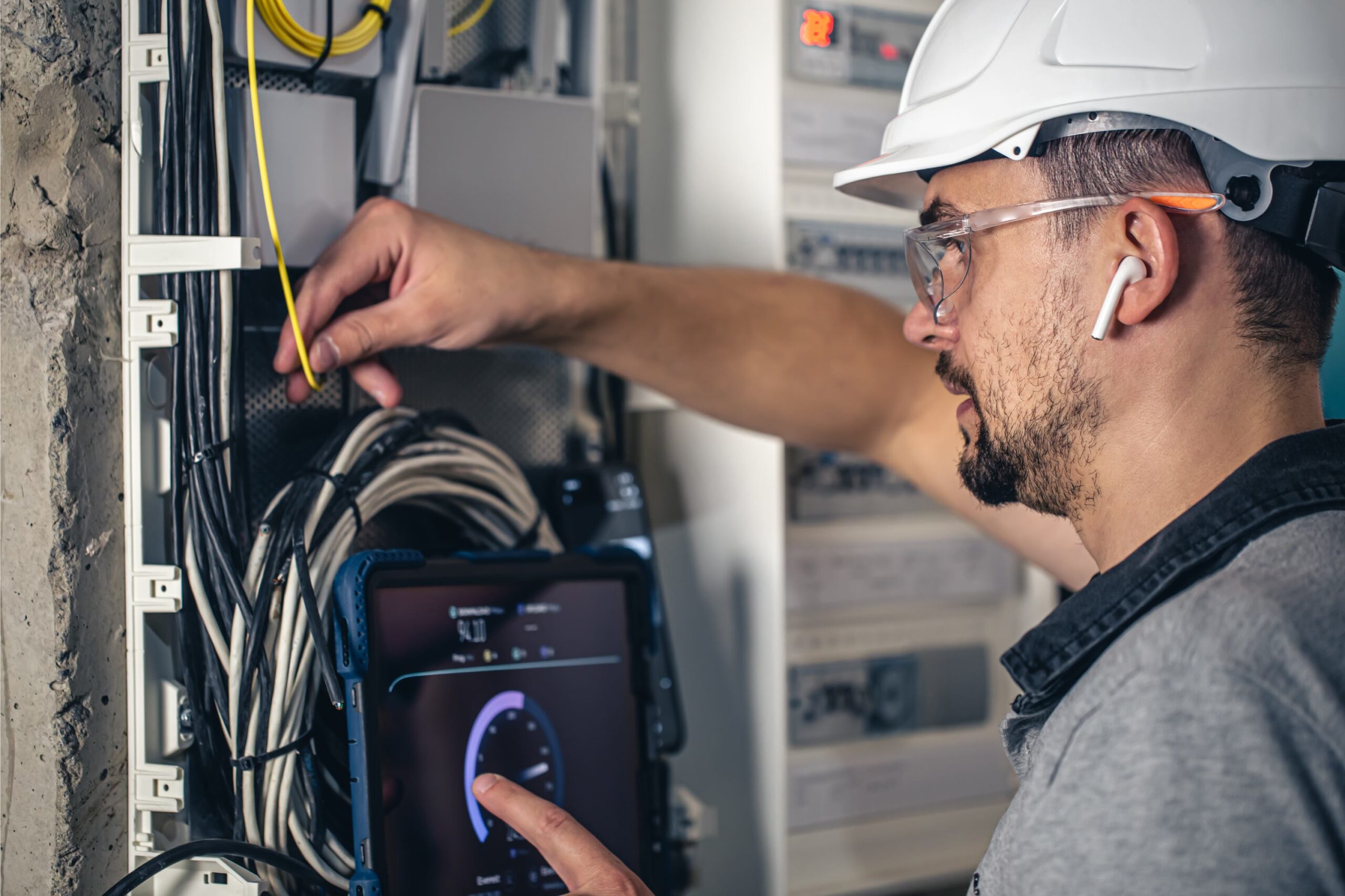 man-electrical-technician-working-switchboard-with-fuses